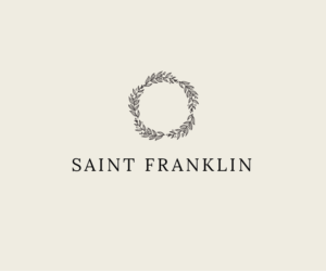 SAINT FRANKLIN in a stylized classical font with a simple wreath above | Logo-Design von Andrew