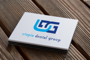 Logo-Design von codeuridea für Utopia Dental group | Design: #7720243