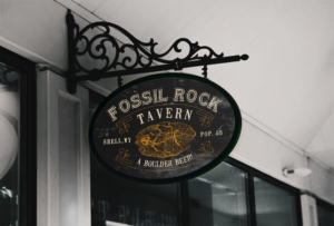 Chillin' at THE FOSSIL ROCK TAVERN, Shell, Wyoming | Diseño de Logo por JonnyGeorgeson