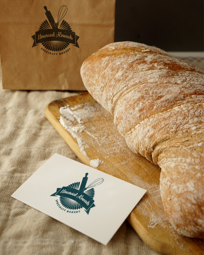 Diseño de Logo por daviddaviesgd para Unusual Kneads | Diseño #10190070