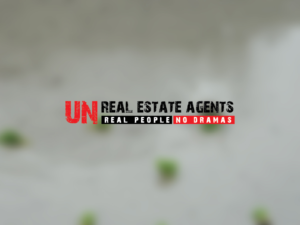 Logo Design by KeyReative_Krowd for UN Realty | Design: #13723563
