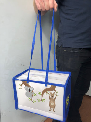 Swinging carry bag box for duty free shoppers | Graphic Design by Rickyy