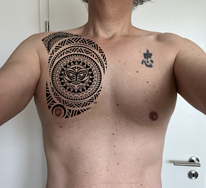 Modern Tribal chest tattoo with love message