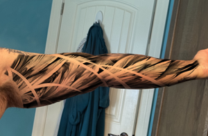 Realism Feathered inner arm wing tattoo